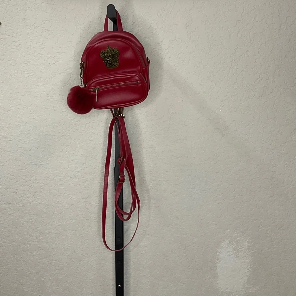 Elegant Red Backpack with Pom Pom Charm